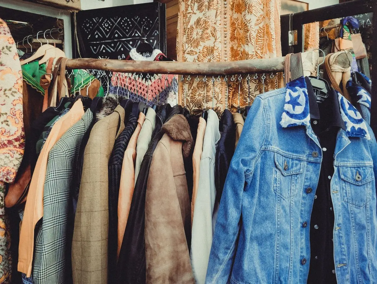 Illustrative photo: rack of vintage jackets including faded denim