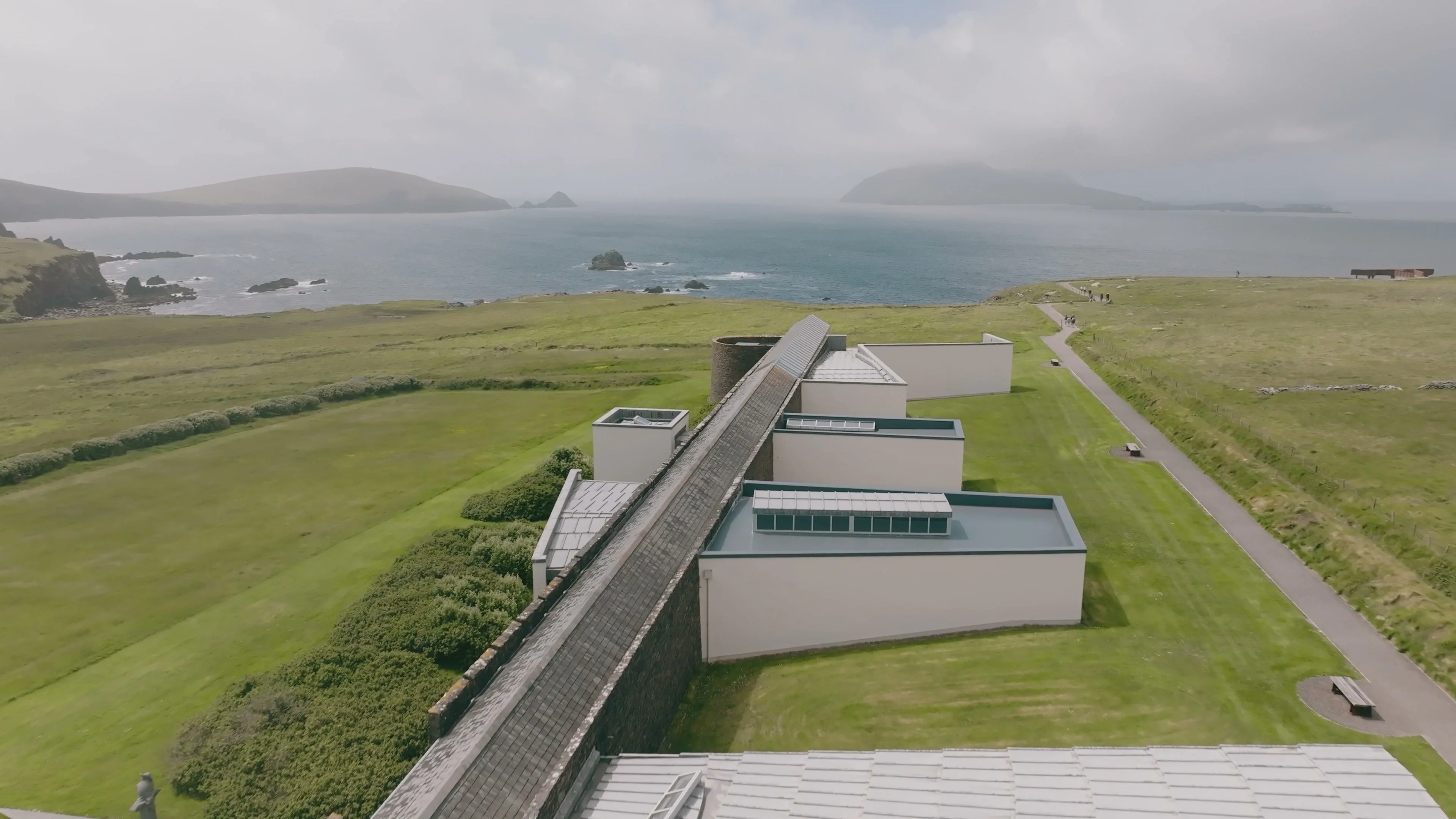 The Blasket Centre in Dún Chaoin from the air, with the sea and the Blasket Islands behind