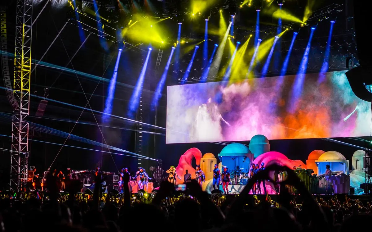 Illustrative photo: live concert stage with colourful lights