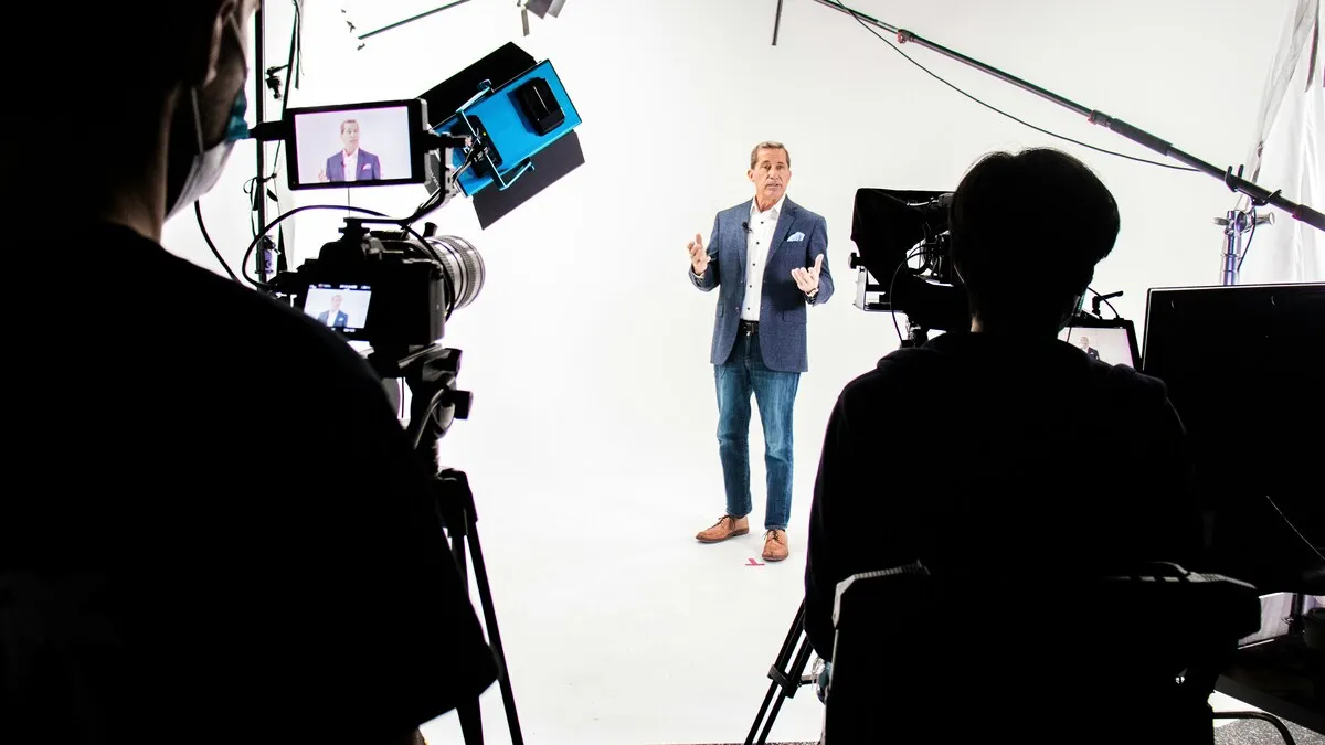 Irish business founder recording an authentic company story video with a production team